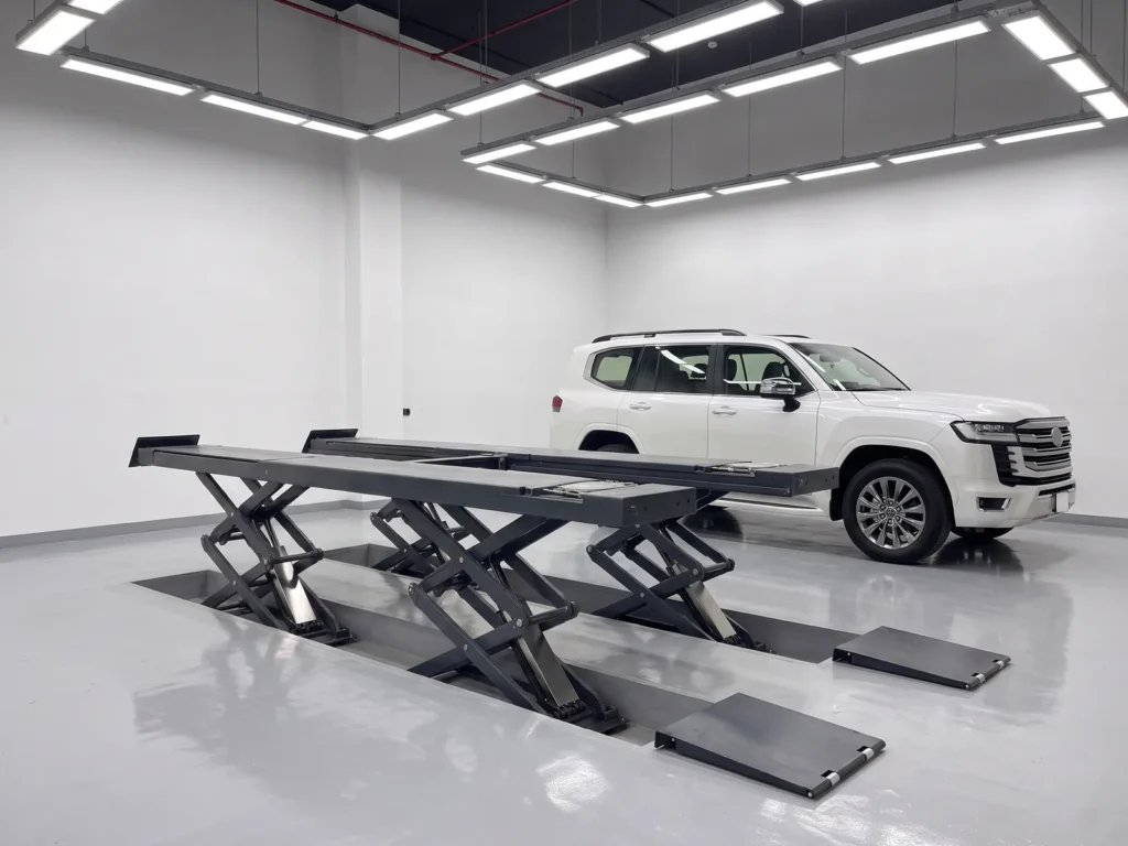 Ultrathin small-platform scissor lift 4500 kg, wide view inside the workshop